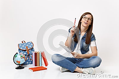 Young casual smart woman student recalling pondering thinking looking up pointing pencil up near globe backpack, school Stock Photo