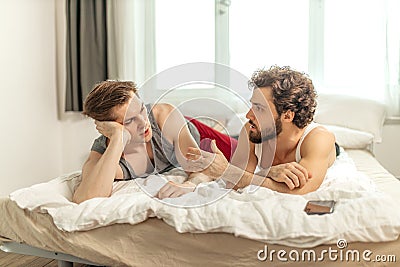 Married gay couple solving problems in their relationships Stock Photo