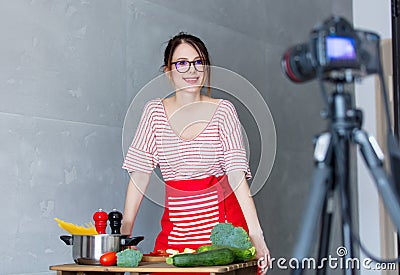 Young caucasian blogger woman cooking Vegan food Stock Photo