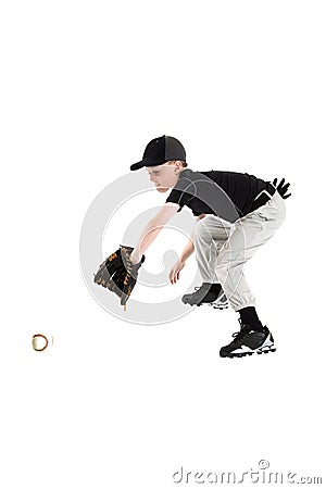 Young caucasian boy catching a baseball with mitt backhanded Stock Photo