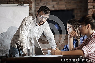 Young caucasian freelancers having online business presentation in cafe Stock Photo