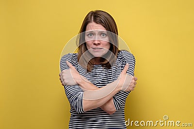 Young caucasian freezing woman feeling ill or cold Stock Photo