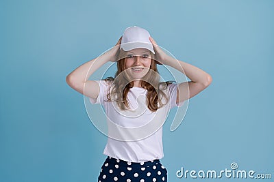 Young caucasian girl in delivery uniform and white cap looks confident Stock Photo