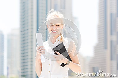 Successful businesswoman agent walking in the city. Stock Photo