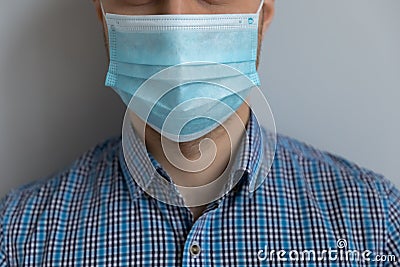 Young Caucasian man in casual wearing medical mask on face Stock Photo