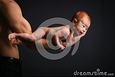 Young Caucasian man holding little son Stock Photo