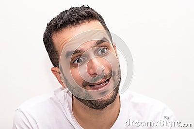 Young Caucasian man looks surprised, isolated Stock Photo