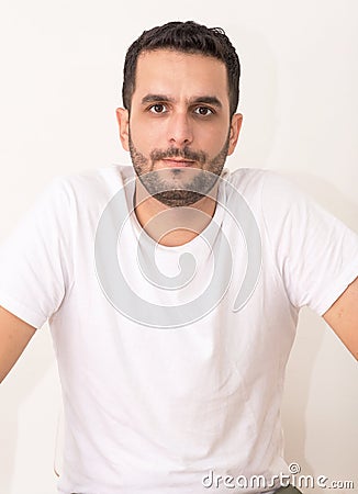 Young caucasian seems serious on camera Stock Photo