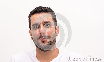 Young Caucasian man looks surprised, isolated Stock Photo