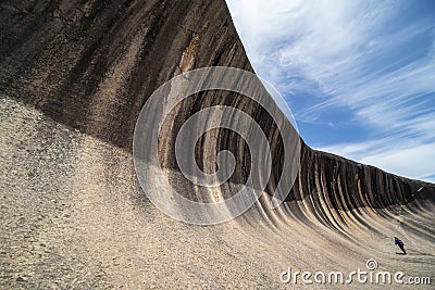 Young caucasian man standing at Wave Rock. Wave Rock Editorial Stock Photo