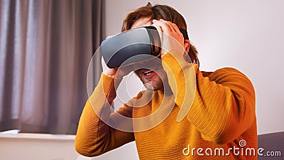 Young caucasian man using VR goggles Stock Photo