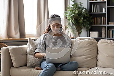 Young Caucasian woman using laptop at home Stock Photo