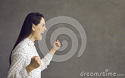 Young caucasian woman screaming showing furious face side view portrait Stock Photo