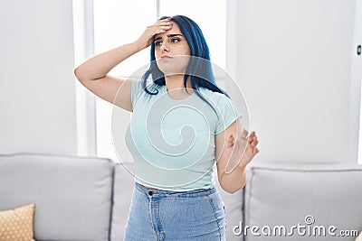 Young caucasian woman suffering dizzy standing at home Stock Photo