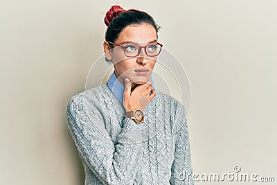 Young caucasian woman wearing casual clothes and glasses touching painful neck, sore throat for flu, clod and infection Stock Photo