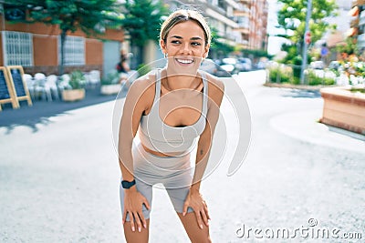 Young cauciasian fitness woman wearing sport clothes training outdoors Stock Photo