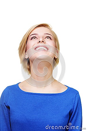 Young cheerful blonde woman looking up Stock Photo