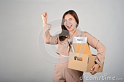 Young cheerful businesswoman celebrating after quitting her job Stock Photo