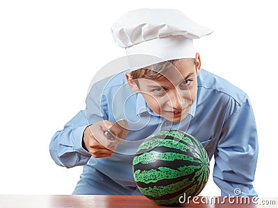 Young cheerful teenager guffaw, laugh loud and humor in a chef's hat. Isolated studio Stock Photo