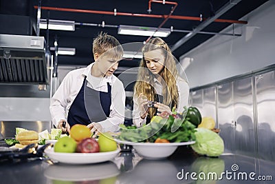 Young chefs are cooking and preparing ingredients Stock Photo