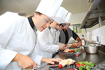 Young chefs preparing delicatessen Stock Photo