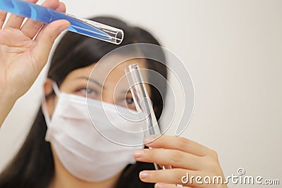 Young chemical female researcher holding in laboratory Stock Photo