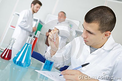 Young chemist makes chemical test in laboratory Stock Photo