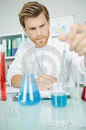 Young chemist makes chemical test Stock Photo