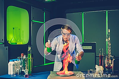 Young chemist making experiments in laboratory Stock Photo