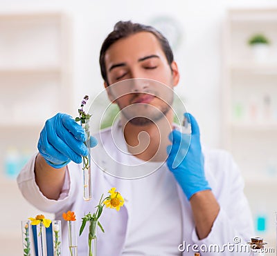 Young male chemist in perfume synthesis concept Stock Photo