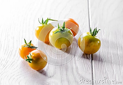 Young cherry tomato on white Stock Photo