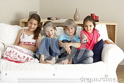 Young Children Watching Television at Home Stock Photo