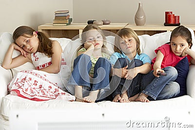 Young Children Watching Television at Home Stock Photo