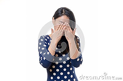 Young Chinese woman covering her eyes Stock Photo