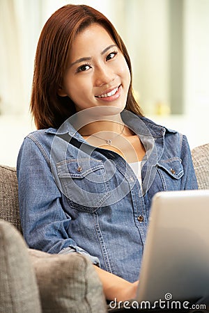 Young Chinese Woman Using Laptop Stock Photo