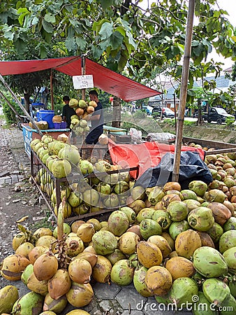 Young coconut seller in Rawalumbu, Citty Bekasi Editorial Stock Photo