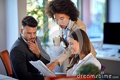 Young colleagues consulting in the office Stock Photo