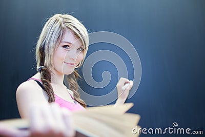 Young college student writing on the chalkboard Stock Photo