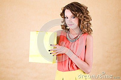 Young colorful dressed woman with color shopping bag Stock Photo