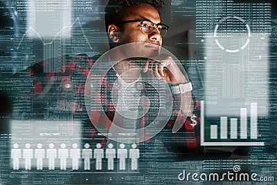 Young concentrated indian SEO specialist looking over advertising conversion Stock Photo