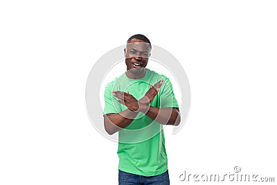 young confident american male advertiser dressed in green t-shirt with mockup gesturing Stock Photo