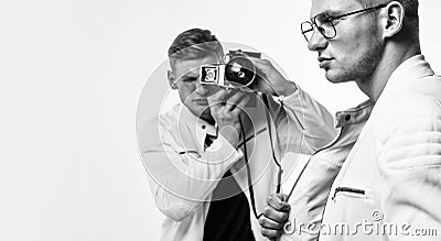 young confident brothers. confident model photographer. twins brother in white. photographing Stock Photo