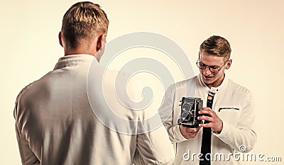 young confident brothers. confident model photographer. twins brother in white. photographing Stock Photo