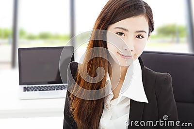 Young confident businesswoman sitting in her office Stock Photo