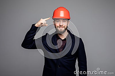 Young construction worker pointed on hard hat Stock Photo