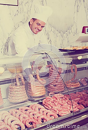 Young cook at butcher store Stock Photo