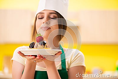 The young cook cooking cakes in the kitchen Stock Photo