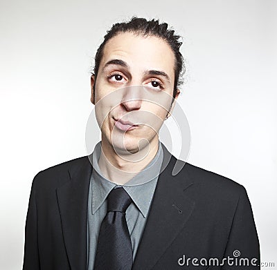 Young cool businessman face expression Stock Photo