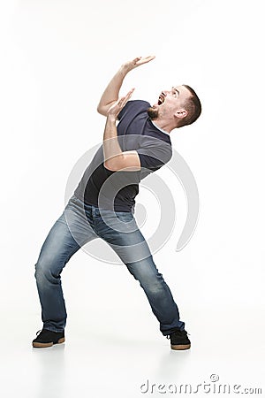 Young cool man full body scared pose. Stock Photo