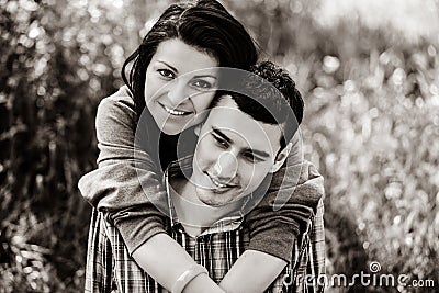 Copule of man and woman on grass in a park Stock Photo